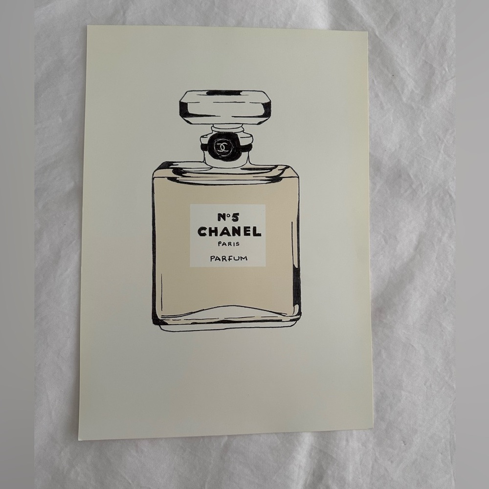 Perfume Illustration in Black and Cream, picture of a drawing on glossy paper.